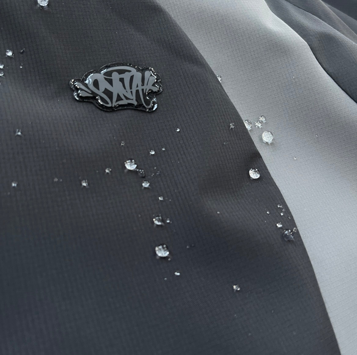 Syna World Vortex Jacket - Black/Grey